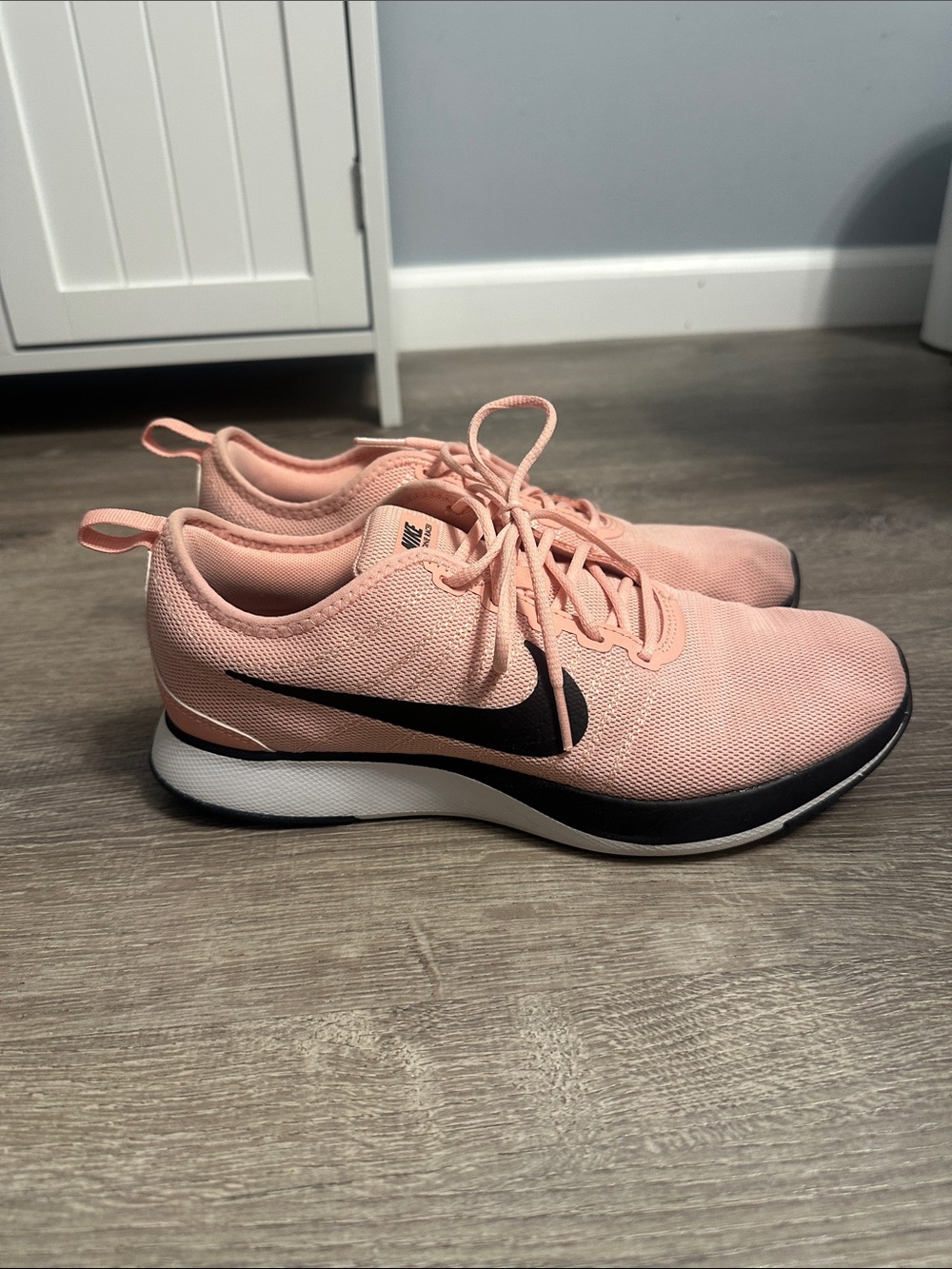 Nike Women's Peach/Pink Lightweight Running Shoes with Black Swoosh